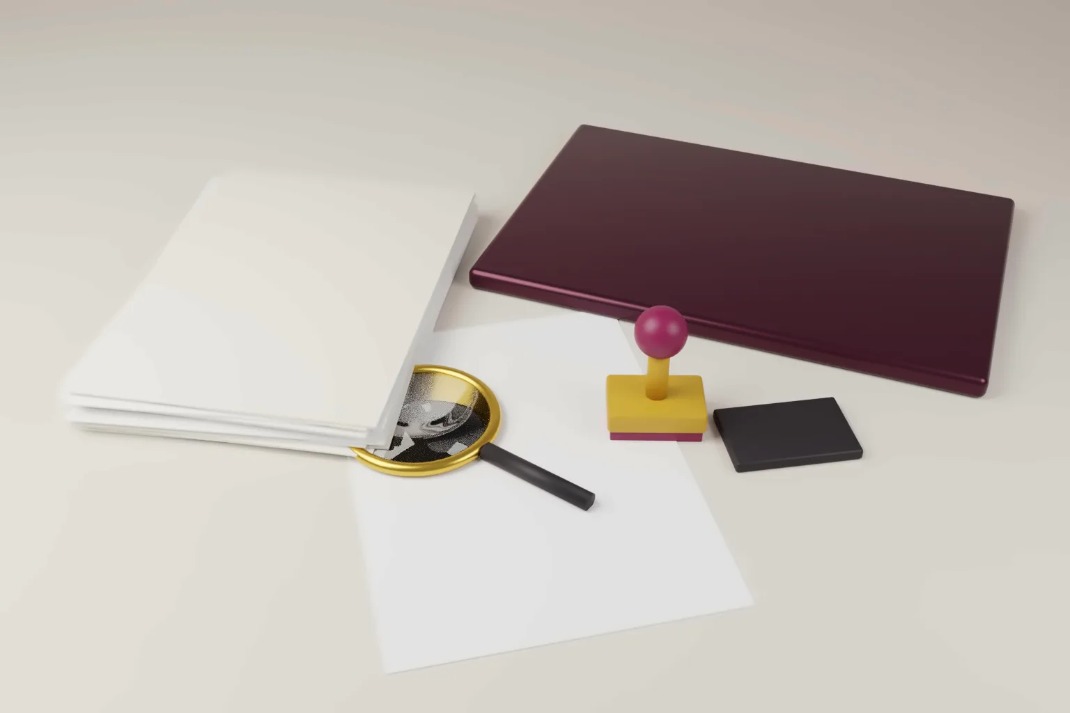 A stack of blank papers, a closed laptop, a rubber stamp, an ink pad and a magnifying glass on a pale desk, in wine and gold tones.