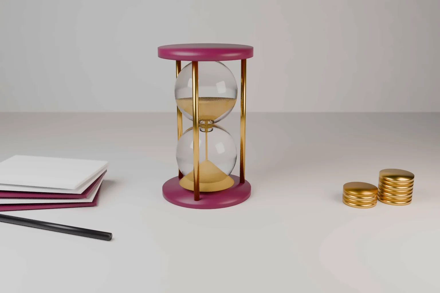 A glass hourglass with gold sand in a wine coloured and gold frame on a pale desk, beside a stack of blank cards, a dark pen and small stacks of plain gold discs.