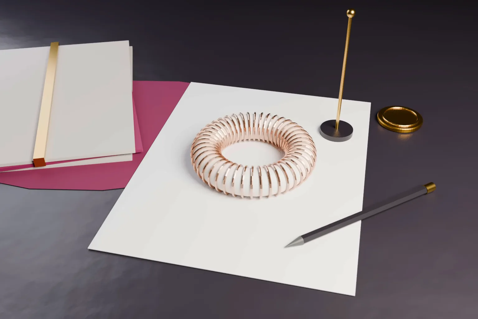 A white ceramic ring core wound with copper wire, a thin gold rod on a dark base, a pencil and a plain gold seal on a blank sheet on a dark desk.