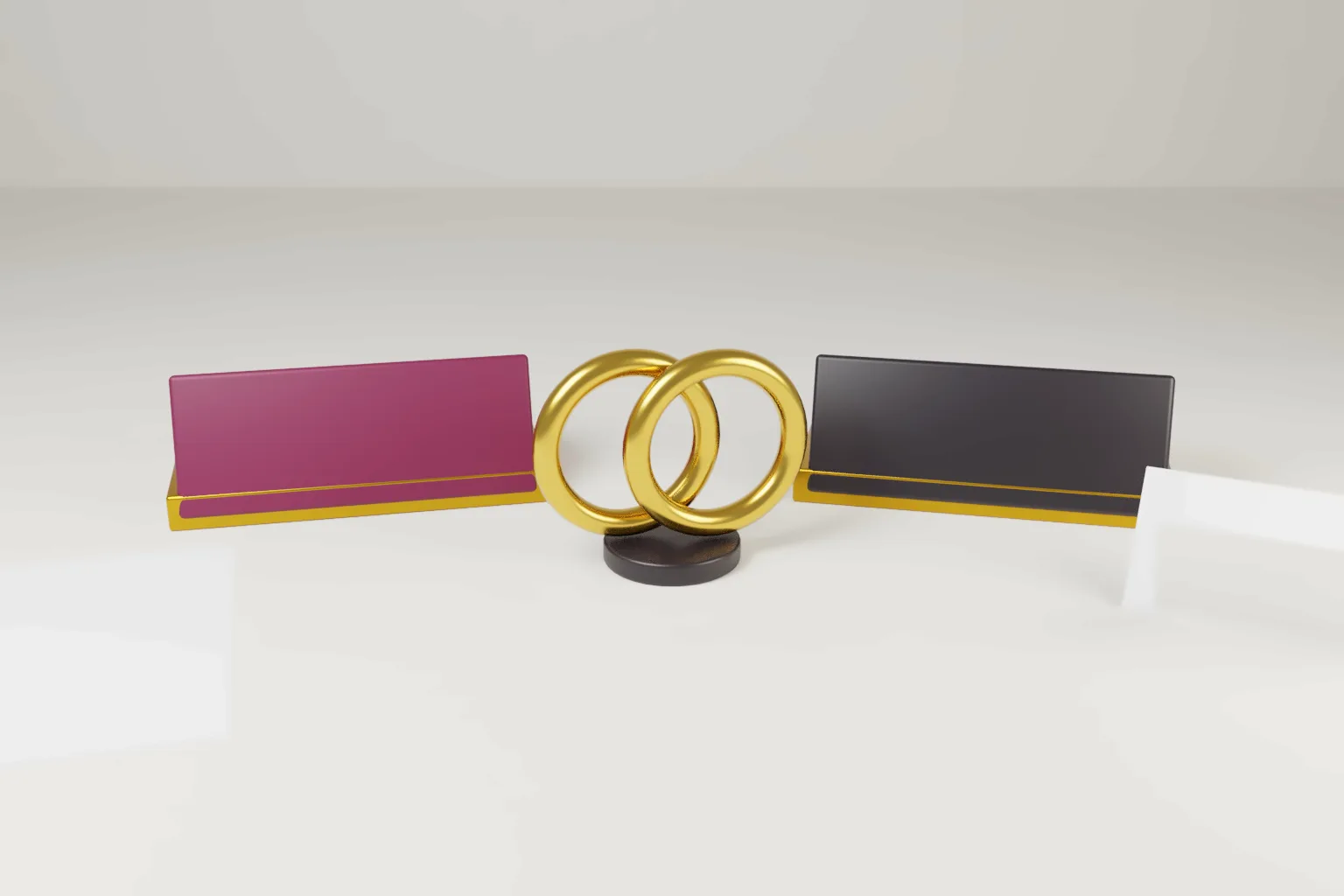 Two blank name plates in wine and ink on a pale desk, joined by one pair of linked gold rings, with a blank folded card.