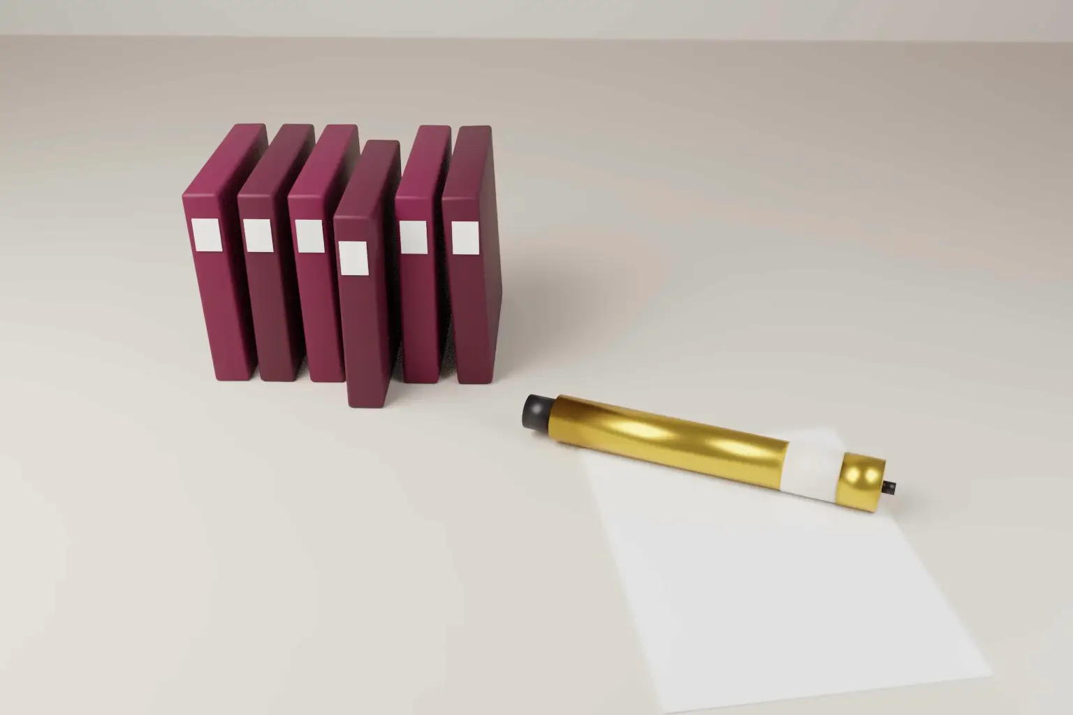 A gold pen injector resting beside a row of plain wine coloured folders on a pale desk, one folder slightly pulled out.
